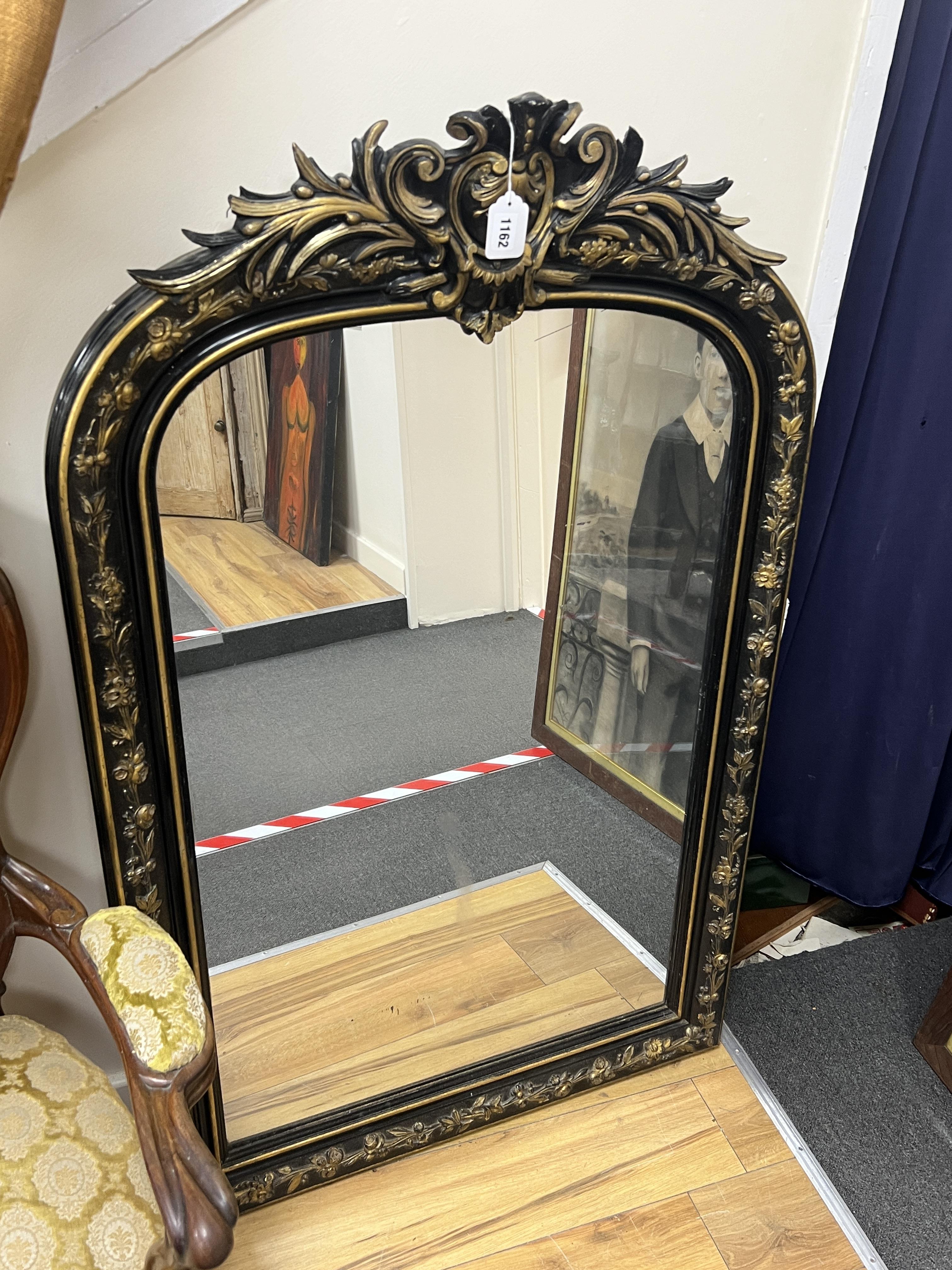 A late 19th century Napoleon III ebonised and gilt mirror, width 82cm, height 130cm.